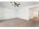 Large bedroom with neutral carpet and views to connecting hallway at 1553 Ravanusa Dr, Henderson, NV 89052