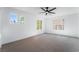 Bedroom featuring three windows and a modern ceiling fan at 1553 Ravanusa Dr, Henderson, NV 89052