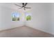 Carpeted bedroom with two windows at 1553 Ravanusa Dr, Henderson, NV 89052