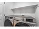 Laundry room featuring front loading washer and dryer at 1553 Ravanusa Dr, Henderson, NV 89052