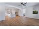 Open-concept living area showcasing a modern kitchen and access to the staircase at 1553 Ravanusa Dr, Henderson, NV 89052