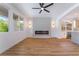 Open living space with modern fireplace, sleek lighting, and beverage bar area at 1553 Ravanusa Dr, Henderson, NV 89052