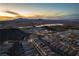 Picturesque aerial view of a Las Vegas community at sunset with desert and lake views at 174 Cabo Cruces Dr, Henderson, NV 89011