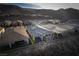 Beautiful aerial view of the backyard, patio, and solar panels on a home at 174 Cabo Cruces Dr, Henderson, NV 89011