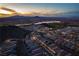 Beautiful sunset aerial view of a modern community in Las Vegas, Nevada, showcasing desert and lake at 174 Cabo Cruces Dr, Henderson, NV 89011