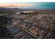 Scenic aerial view of a neighborhood with closely built homes and desert landscapes at 174 Cabo Cruces Dr, Henderson, NV 89011