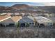 Charming home exterior with a cozy patio and mountain views at 174 Cabo Cruces Dr, Henderson, NV 89011