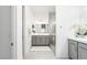 Bright bathroom with double vanity, modern fixtures, and a glass shower at 174 Cabo Cruces Dr, Henderson, NV 89011