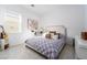Comfortable bedroom with a large bed, side table, and window with natural light at 174 Cabo Cruces Dr, Henderson, NV 89011