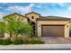 Beautiful home with a two-car garage, desert landscaping and excellent curb appeal at 174 Cabo Cruces Dr, Henderson, NV 89011