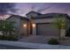 Charming home showcasing a well-maintained yard, desert landscaping, and inviting front entrance at 174 Cabo Cruces Dr, Henderson, NV 89011