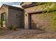 Close-up of a two-car garage with brick driveway, highlighting the home's curb appeal and convenient parking at 174 Cabo Cruces Dr, Henderson, NV 89011