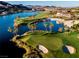 Lakeside golf course with palm trees and lush landscaping on a sunny day at 174 Cabo Cruces Dr, Henderson, NV 89011