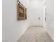 Entry hallway with tile flooring, art and a bright, neutral color palette at 174 Cabo Cruces Dr, Henderson, NV 89011