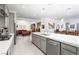 Open floor plan with a kitchen island flowing into the living room with ornate furnishings at 174 Cabo Cruces Dr, Henderson, NV 89011