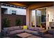 Relax on the covered patio with comfortable seating and easy access to the home's interior at 174 Cabo Cruces Dr, Henderson, NV 89011