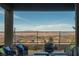 Inviting patio with stylish seating and stunning views of the valley and mountains, creating a serene outdoor space at 174 Cabo Cruces Dr, Henderson, NV 89011