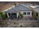 Inviting rear patio features covered seating area, outdoor dining, and fenced yard at 174 Cabo Cruces Dr, Henderson, NV 89011