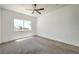 Bright bedroom with a ceiling fan and a large window letting in plenty of natural light at 2110 Los Feliz St # 1003, Las Vegas, NV 89156