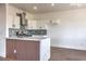 Modern kitchen with a peninsula, stainless steel appliances, and white cabinets against backsplash at 2110 Los Feliz St # 1003, Las Vegas, NV 89156