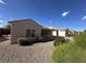 Well-maintained backyard offering a serene outdoor space with decorative rock landscaping and lush green accents at 2224 Waterton Rivers Dr, Henderson, NV 89044