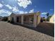 Backyard featuring decorative rock, covered patio, and ample space for outdoor relaxation and entertainment at 2224 Waterton Rivers Dr, Henderson, NV 89044