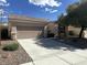 Beautiful home showcasing a spacious driveway leading to a two-car garage at 2224 Waterton Rivers Dr, Henderson, NV 89044