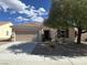 Charming single-story home featuring a two-car garage and inviting front yard landscaping at 2224 Waterton Rivers Dr, Henderson, NV 89044