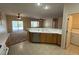 Functional kitchen area with ample counter space and a view of the adjacent backyard and living area at 2224 Waterton Rivers Dr, Henderson, NV 89044