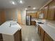 Well-lit kitchen featuring bright countertops, wooden cabinets, and stainless steel appliances at 2224 Waterton Rivers Dr, Henderson, NV 89044
