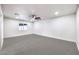 Spacious bedroom with neutral carpet, recessed lighting, and a modern ceiling fan at 2536 Herrod Dr, North Las Vegas, NV 89030