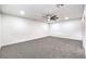 Large bedroom with plush carpeting, a modern ceiling fan, and bright recessed lighting at 2536 Herrod Dr, North Las Vegas, NV 89030