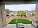 Relaxing backyard with artificial grass and stone accents, perfect for outdoor enjoyment at 2558 Divine Sky Dr, Henderson, NV 89044
