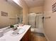 Bathroom with a single sink vanity, toilet, and a shower with sliding doors at 2558 Divine Sky Dr, Henderson, NV 89044