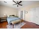 Comfortable bedroom featuring ceiling fan, natural light, and closet doors at 2558 Divine Sky Dr, Henderson, NV 89044