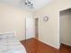 Bedroom featuring wood floors, ceiling fan, a white door to a closet, and an adjoining room at 2558 Divine Sky Dr, Henderson, NV 89044