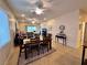 Open-concept dining area featuring tile floors and an adjacent living space at 2558 Divine Sky Dr, Henderson, NV 89044