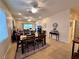 Open-concept dining area with tile floors and an adjacent living space at 2558 Divine Sky Dr, Henderson, NV 89044