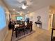 Open-concept dining area leading to a spacious living room with natural light at 2558 Divine Sky Dr, Henderson, NV 89044