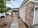 Single-story house with a stone facade, a tidy front yard, and a two-car garage at 2558 Divine Sky Dr, Henderson, NV 89044