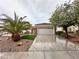 Charming single-story home with well-manicured landscaping and a two-car garage at 2558 Divine Sky Dr, Henderson, NV 89044