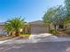 Charming single-story home with a well-manicured lawn, desert landscaping, and a two-car garage at 2558 Divine Sky Dr, Henderson, NV 89044