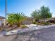 Well-maintained single-story home featuring mature trees, desert landscaping, and an attached two-car garage at 2558 Divine Sky Dr, Henderson, NV 89044