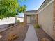 Inviting walkway and front porch entry leading to a single-story home with desert landscaping at 2558 Divine Sky Dr, Henderson, NV 89044