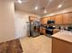 Spacious kitchen with stainless steel appliances and tile flooring at 2558 Divine Sky Dr, Henderson, NV 89044