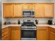 Modern kitchen featuring stainless steel appliances and ample cabinet space at 2558 Divine Sky Dr, Henderson, NV 89044