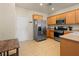 Efficient kitchen with stainless steel appliances, ample cabinet space, and tile flooring at 2558 Divine Sky Dr, Henderson, NV 89044