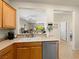 Open-concept kitchen view with sink, dishwasher, and seamless flow to living areas at 2558 Divine Sky Dr, Henderson, NV 89044