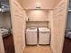 Convenient laundry closet featuring a side-by-side washer and dryer at 2558 Divine Sky Dr, Henderson, NV 89044