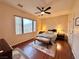 Cozy main bedroom with a ceiling fan and a sunlit window at 2558 Divine Sky Dr, Henderson, NV 89044